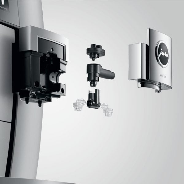 Geöffneter Milchsystemanschluss der JURA GIGA X3c mit Einzelteilen